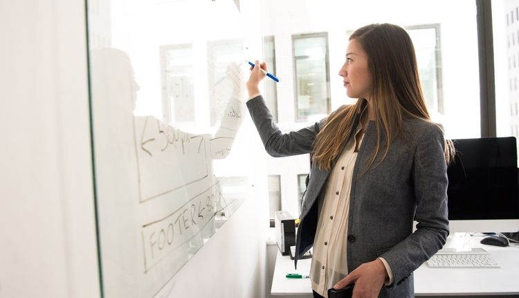 Business Professional Writing on a Whiteboard